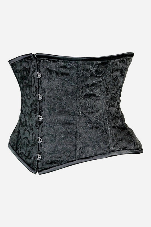 Side view of the black brocade Alluring underbust corset showing its hourglass curve, busk edge and back lacing grommets