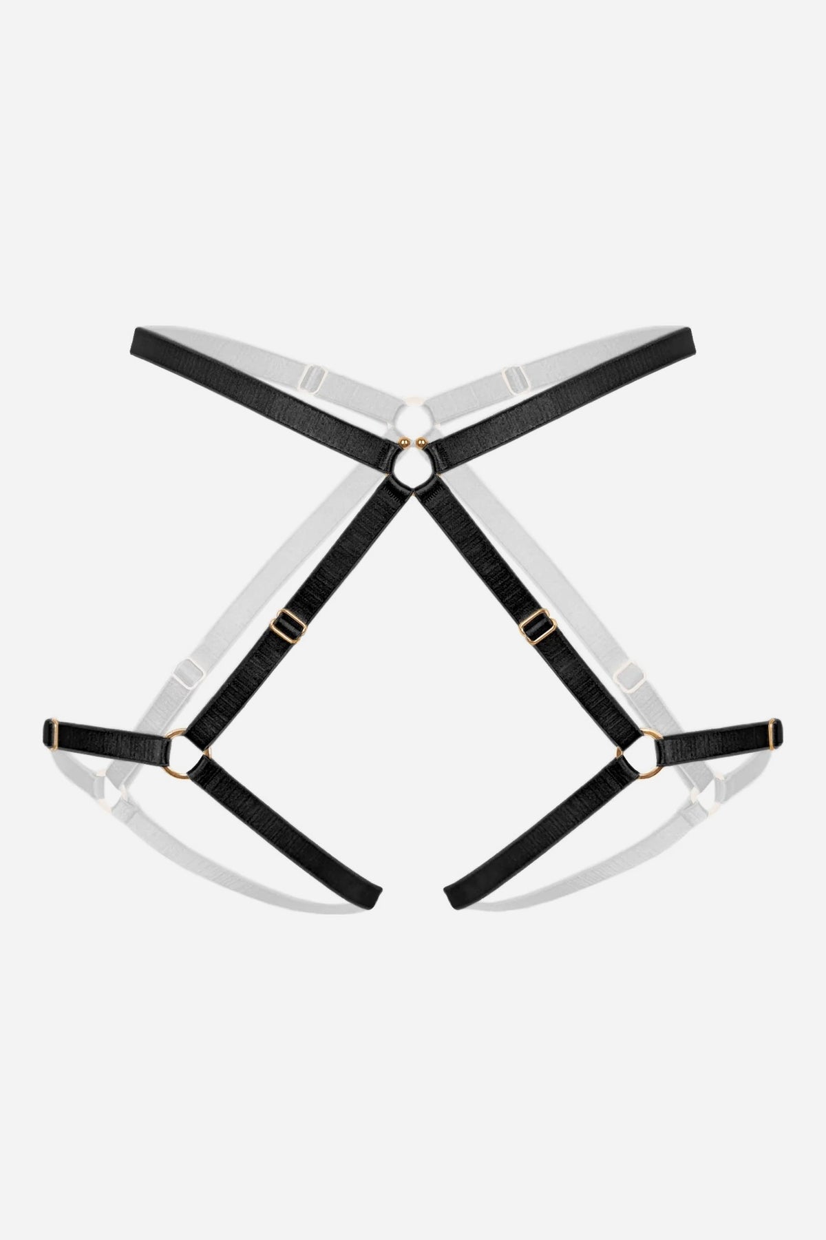 Flat lay of the Monique Morin Amphitrite Rush thigh harness in black with gold-tone O-rings and adjustable sliders on grey