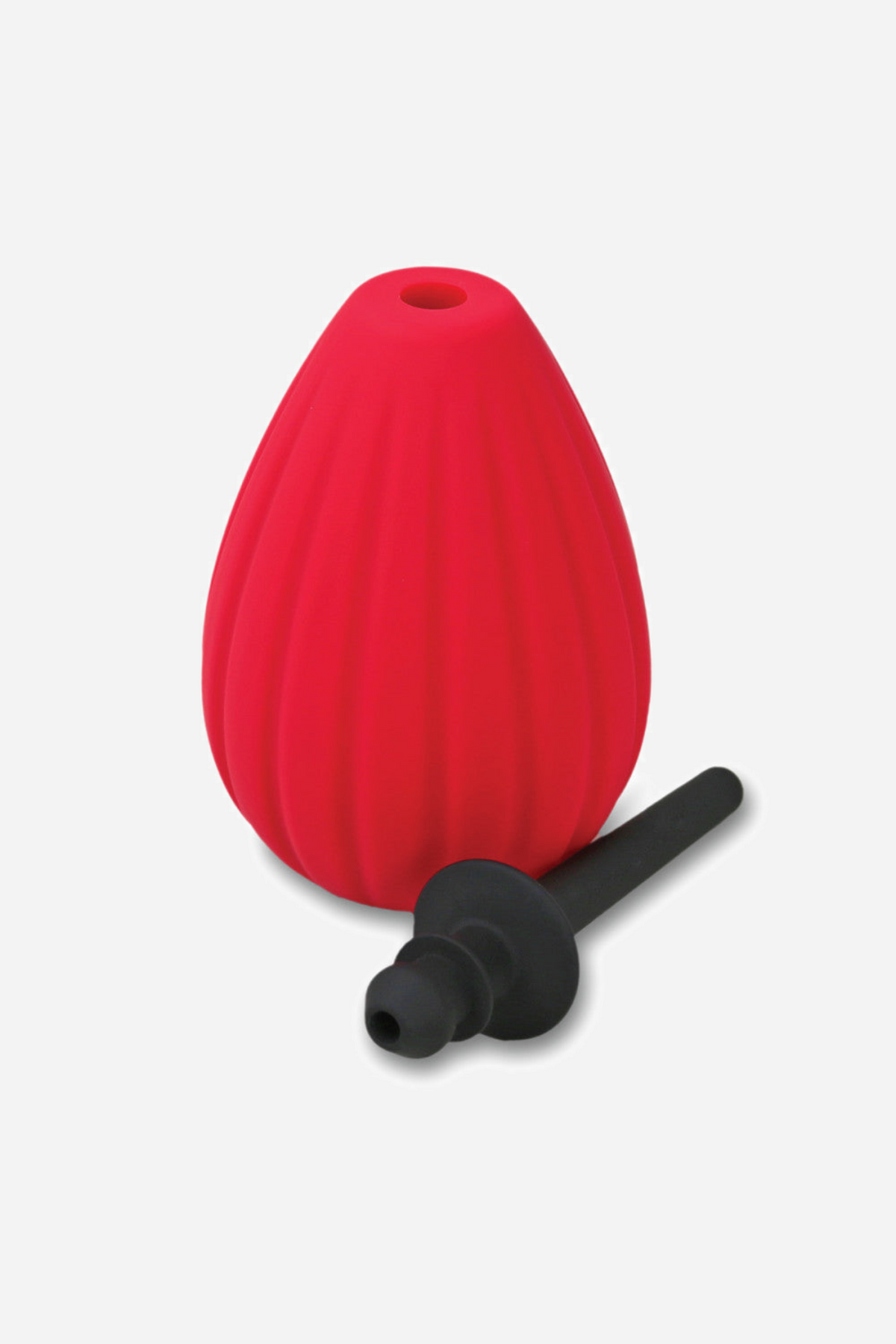The red Prelude enema bulb on grey beside its black nozzle, unscrewed and lying flat to show the two parts come apart for cleaning.