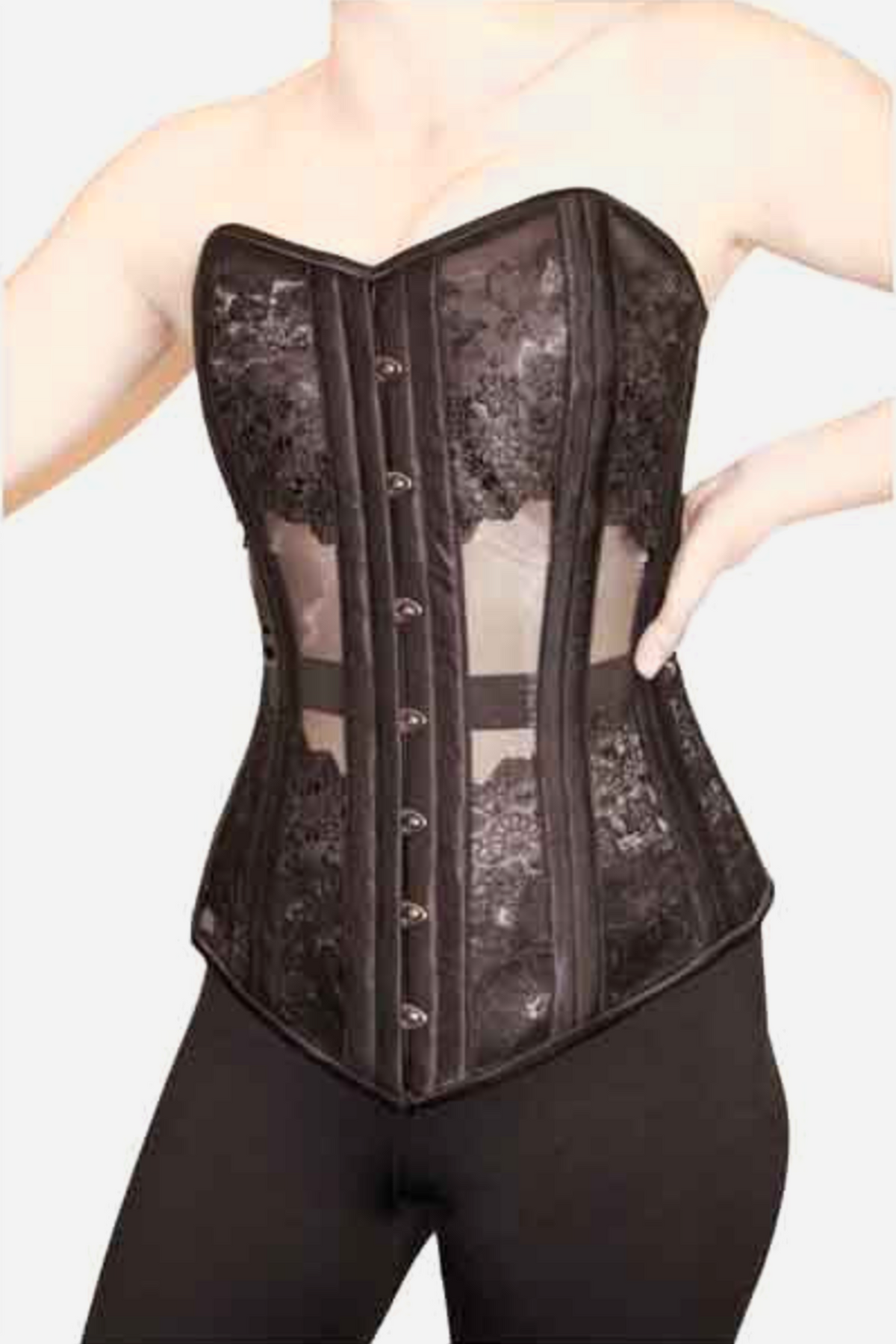 Long black overbust corset with sheer mesh panels, floral lace at the bust and hips, steel boning channels and a front busk, worn by a model in black leggings.
