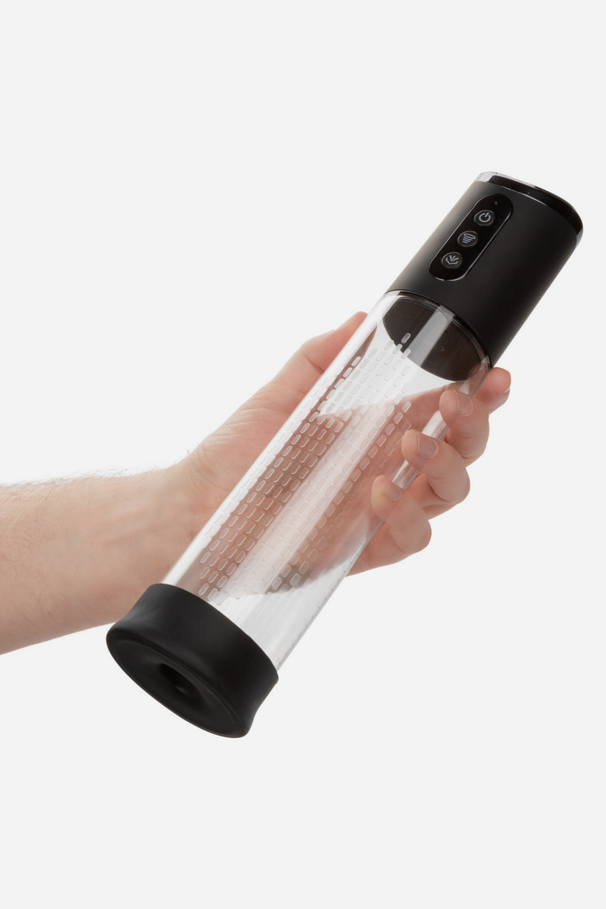 At Your Peak rechargeable penis pump held in one hand, showing the length of the clear cylinder and black motor head, on light grey