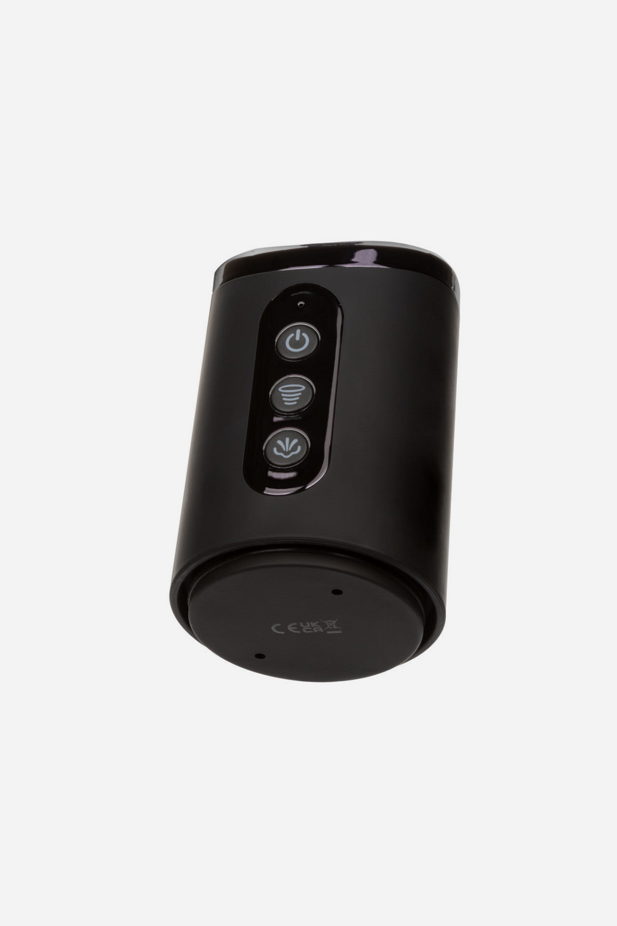 Close-up of the At Your Peak rechargeable penis pump motor head showing the three push-button controls and air release, on light grey