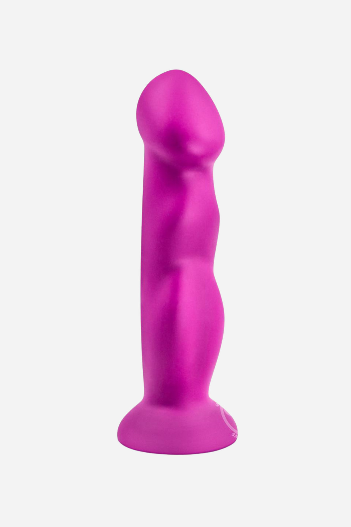 A bright magenta silicone dildo standing upright on its round suction base, the shaft gently curved and sculpted, against a plain grey backdrop.