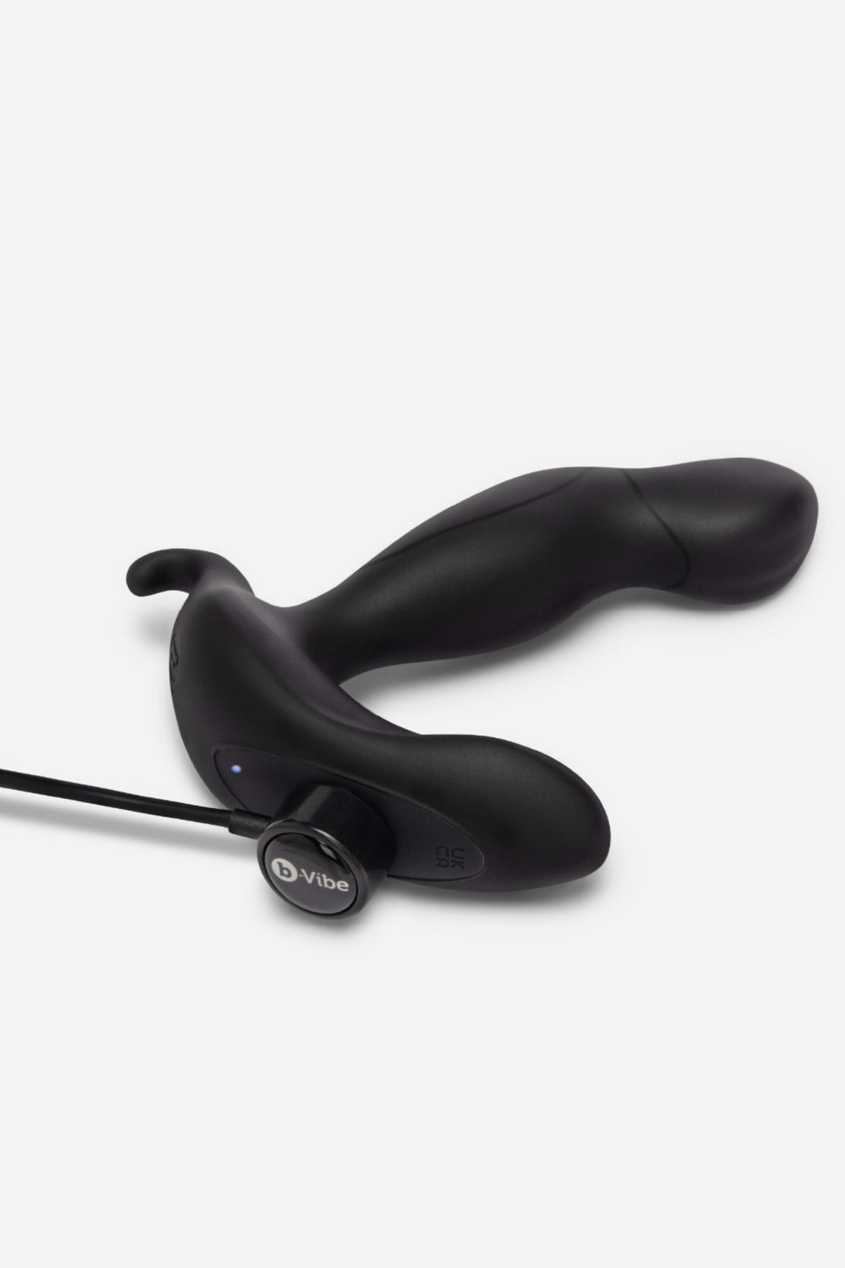 B-Vibe 360 rotating and vibrating plug connected to its USB charging cable, showing the rechargeable base on a grey background