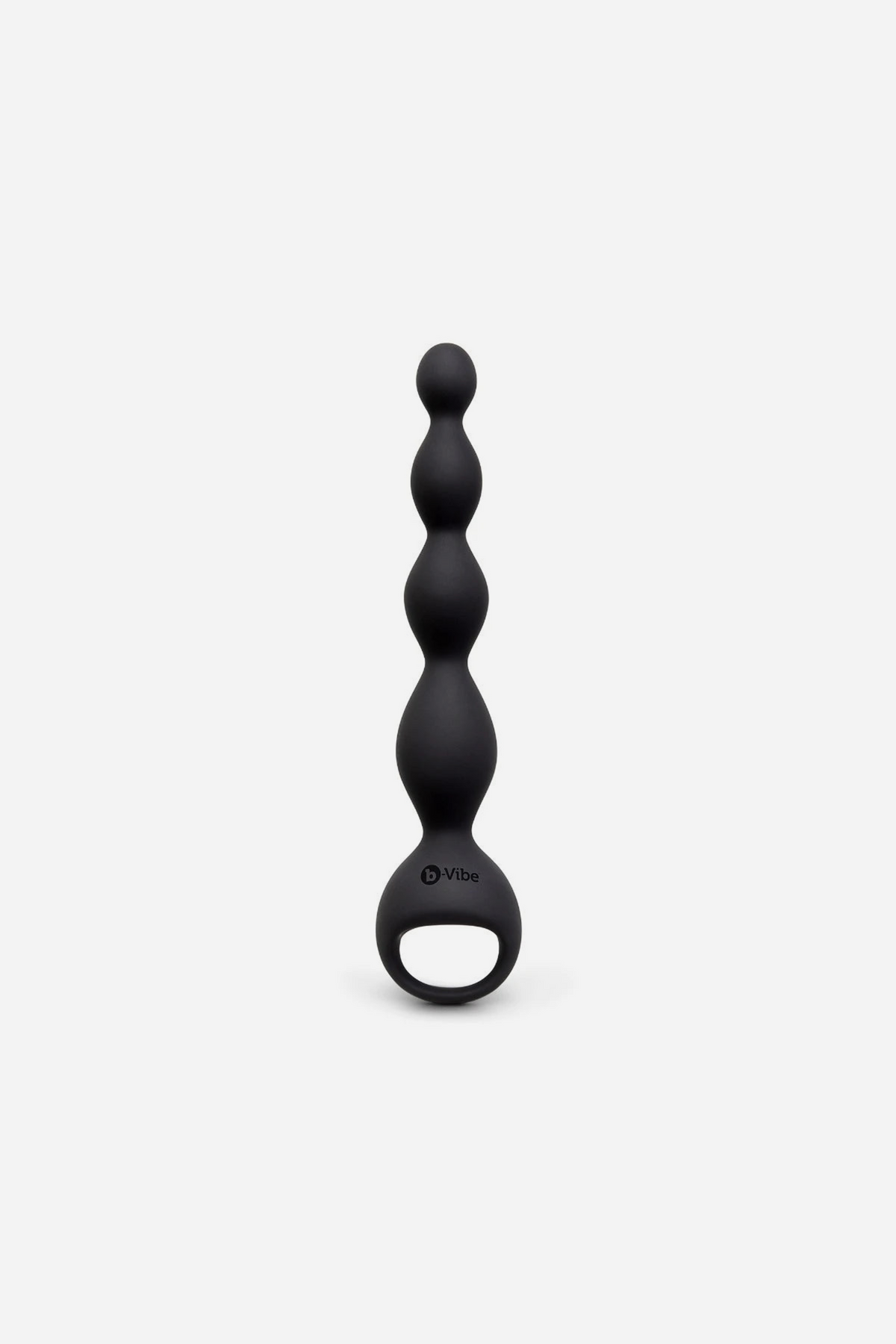 Front view of the black B-Vibe Earth Rumbling vibrating anal beads, showing graduated silicone beads and the ring handle base, on grey