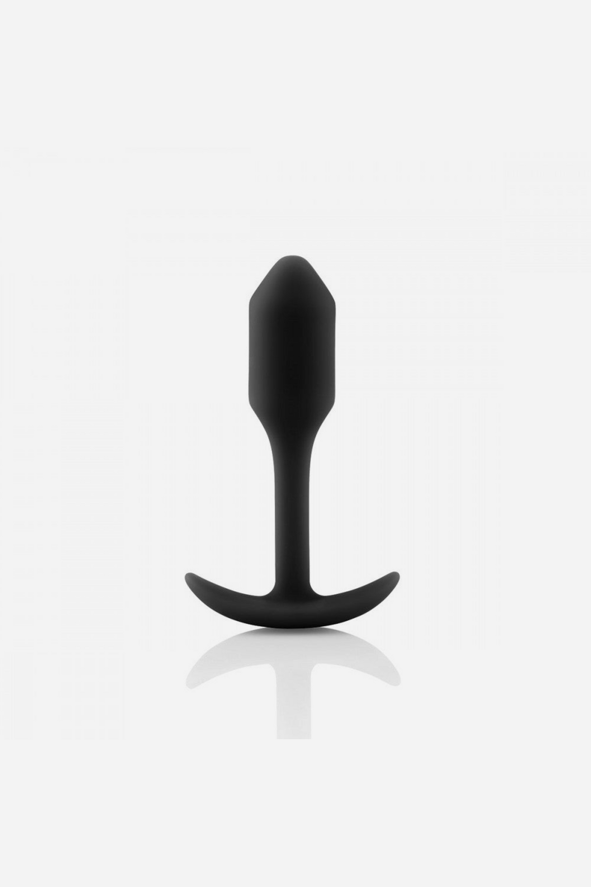 Black B-Vibe Snug Plug 1 small weighted butt plug standing upright on its flared base, showing the smooth silicone body and slim neck