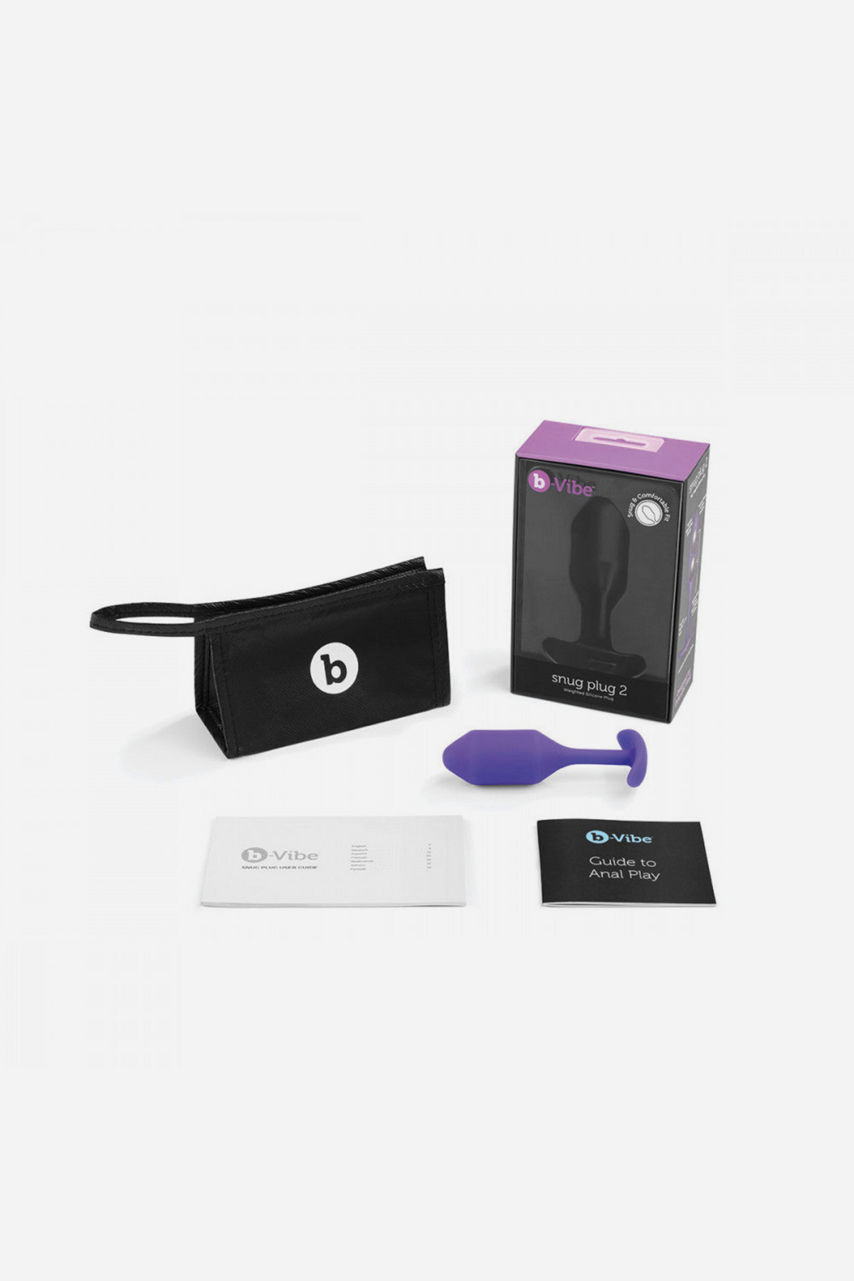 What's in the box: purple B-Vibe Snug Plug 2, retail packaging, black zip travel pouch, instruction booklet and care card laid out on grey