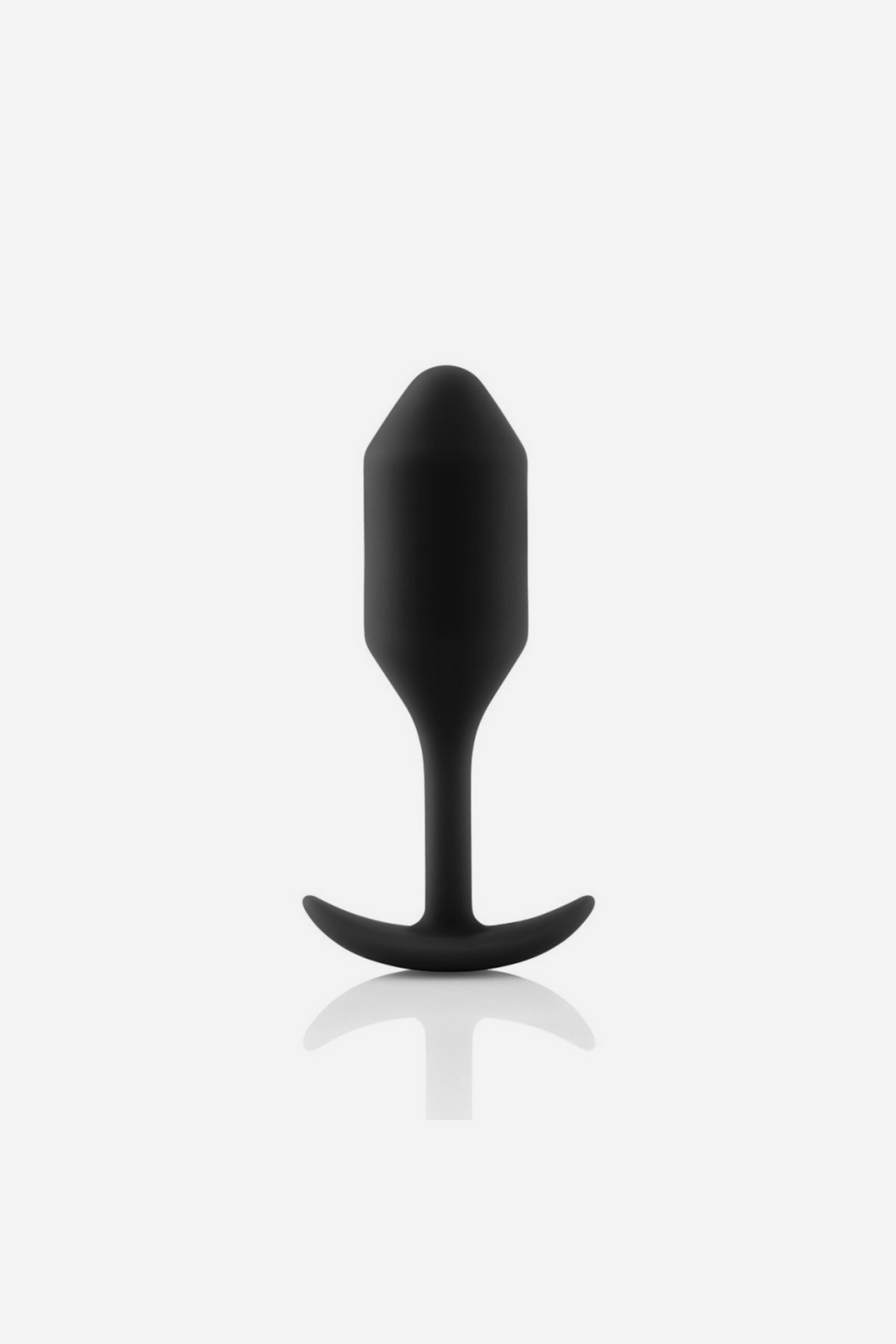 B-Vibe Snug Plug 2 in black standing upright with a soft reflection, showing the weighted torpedo bulb, slim neck and flat flared base
