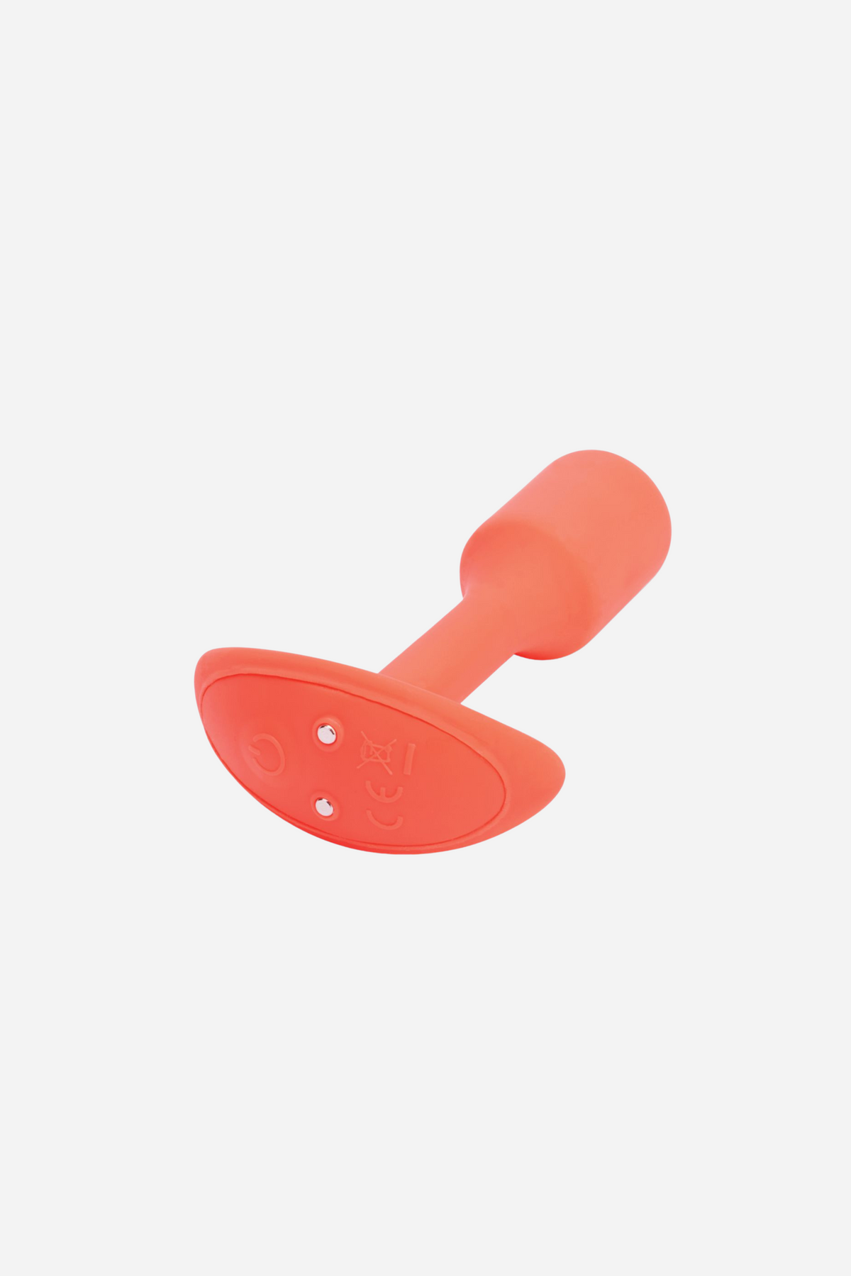 Angled view of the orange B-Vibe Vibrating Snug Plug 1 small showing the flared flat base and the rounded weighted bulb, on grey