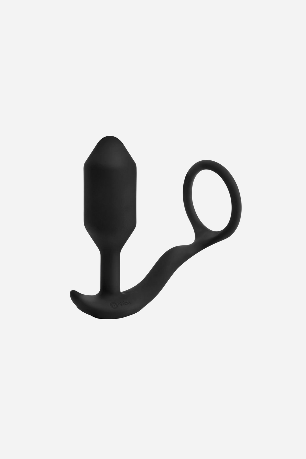Black B-Vibe Vibrating Snug and Tug cock ring plug, a weighted silicone butt plug joined to a stretchy penis ring, on grey