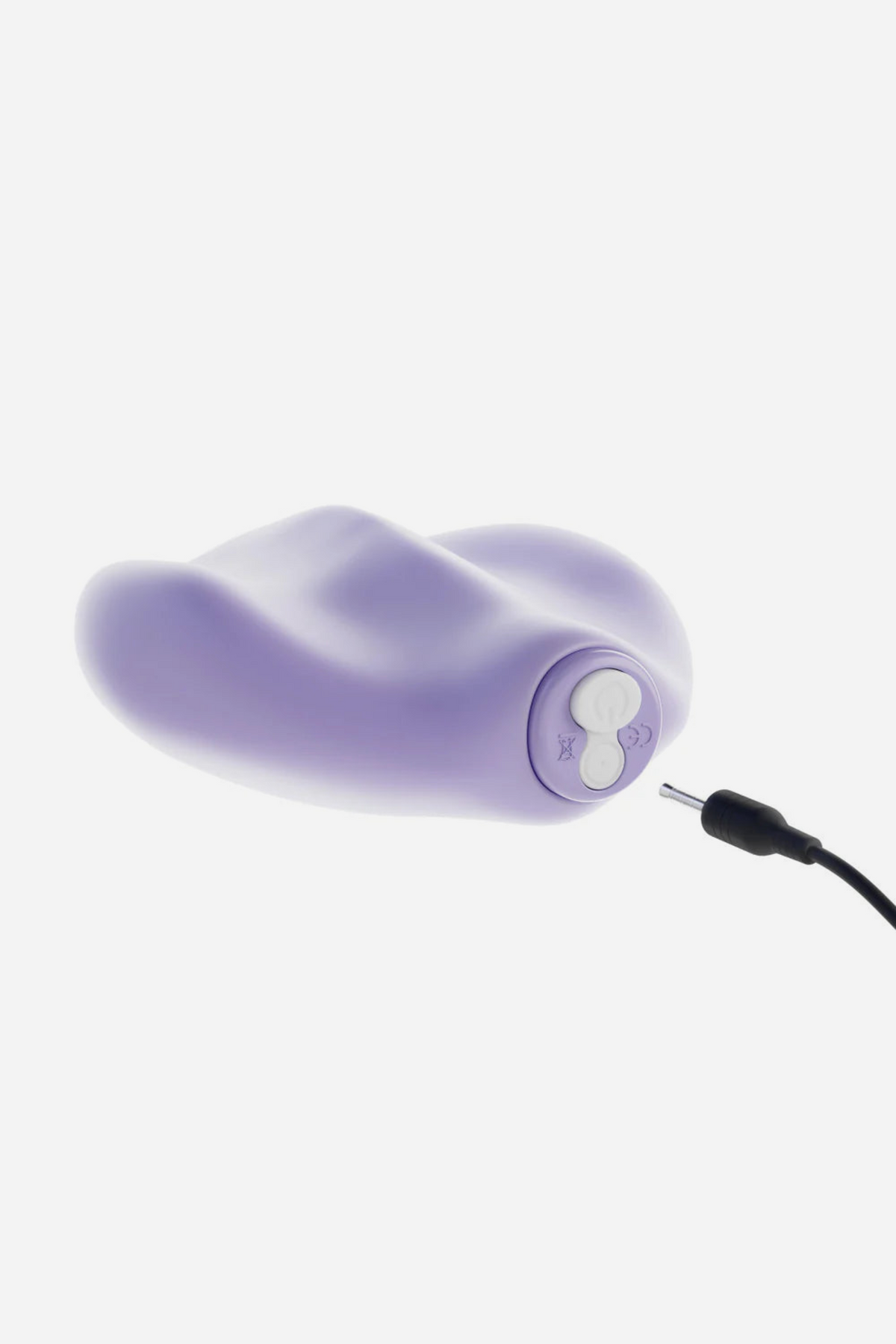 Lavender Be Urself Vibrating Pulse Pad with its magnetic USB charging cable plugged into the end, showing how the rechargeable toy powers up