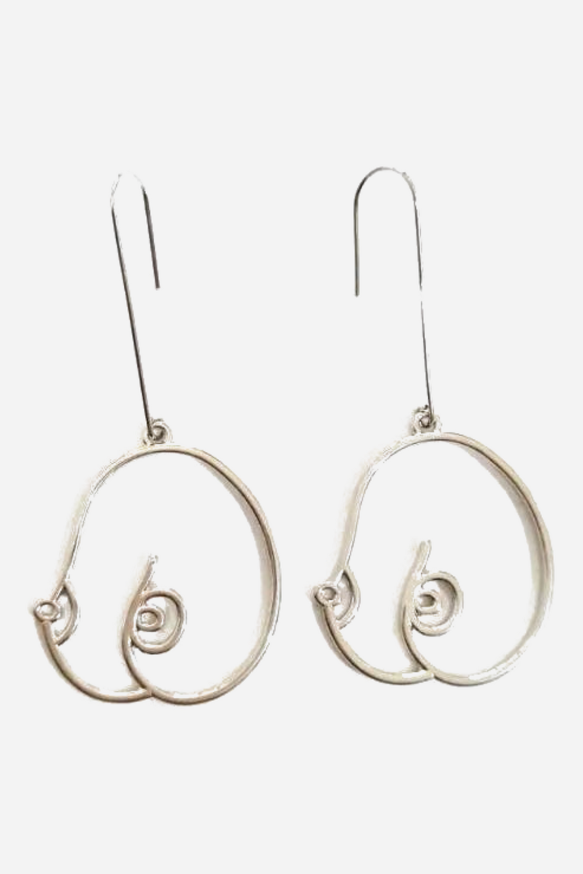 Pair of silver wire boob earrings side by side, each a curved outline of two breasts with spiral nipples, hanging from long french hook ear wires.