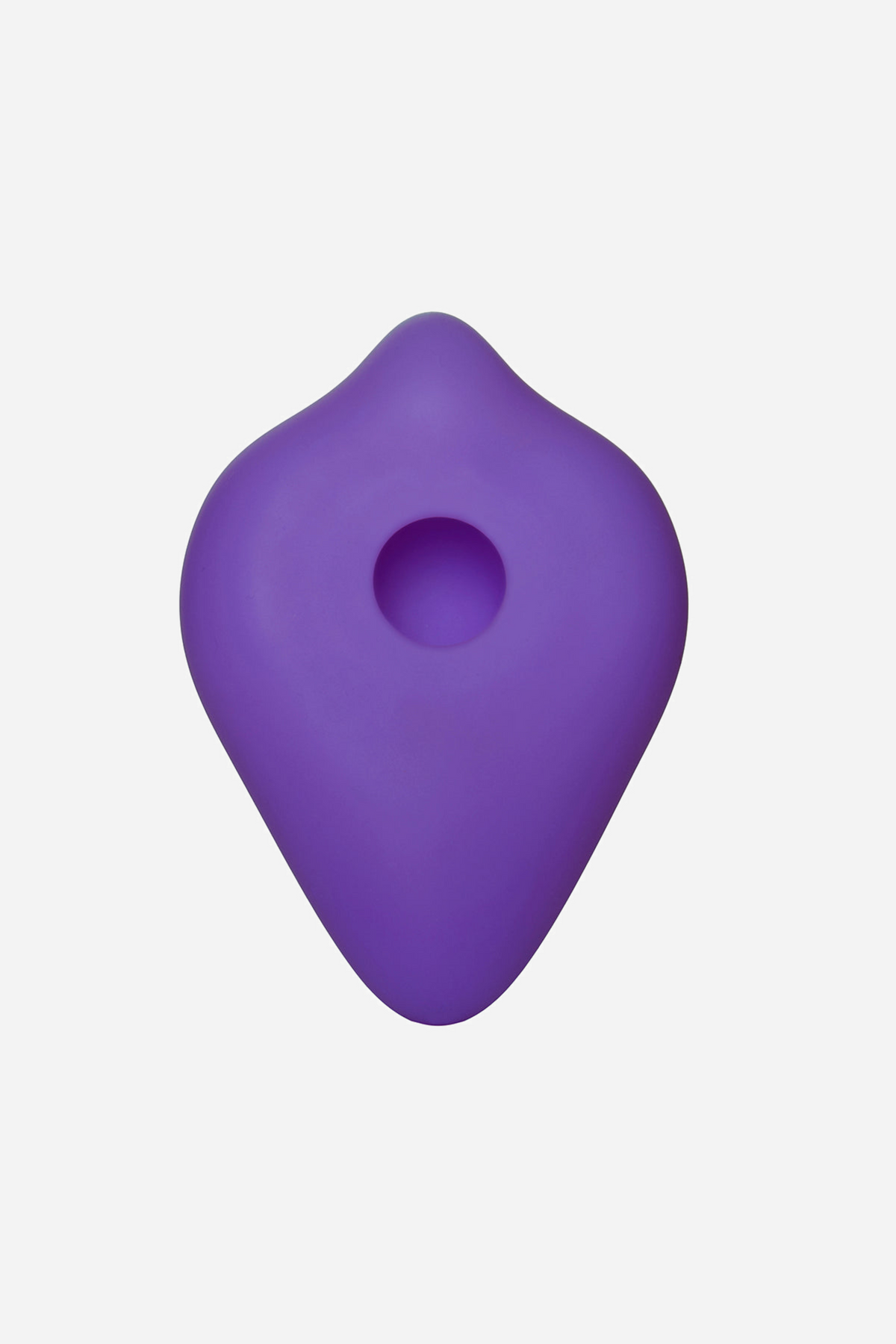 Back of the purple BumpHer pad, its flat rear face and the round central opening that slips down over the base of a favourite dildo.