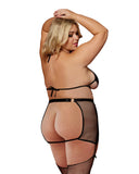 plus size blonde model wearing the fetish lingerie shows off the back of the outfit, revealing a fully open back on top and bottom