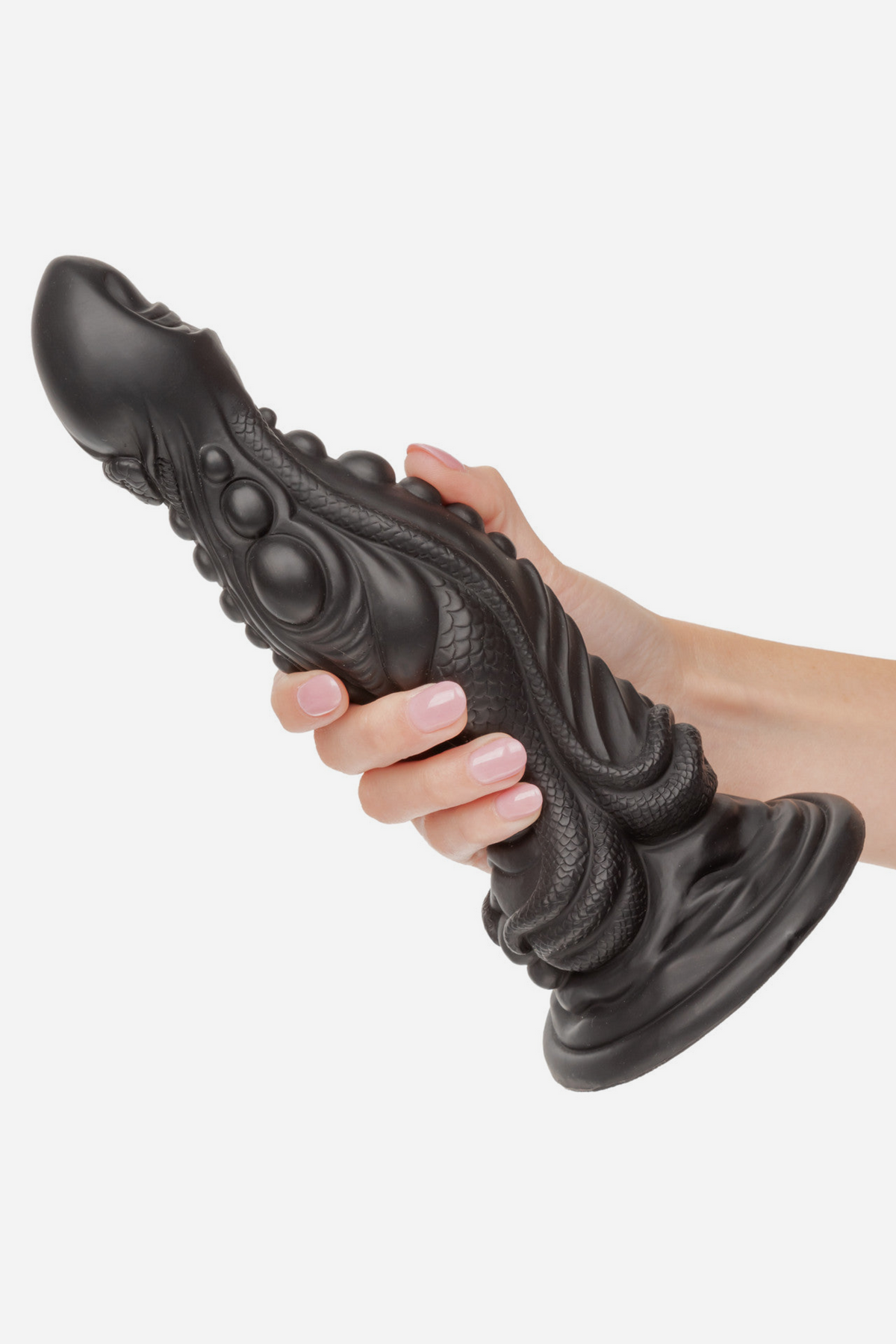 Hand holding the black Colossus Monster Fantasy Dildo by its suction cup base to show its large size and ridged texture, on grey