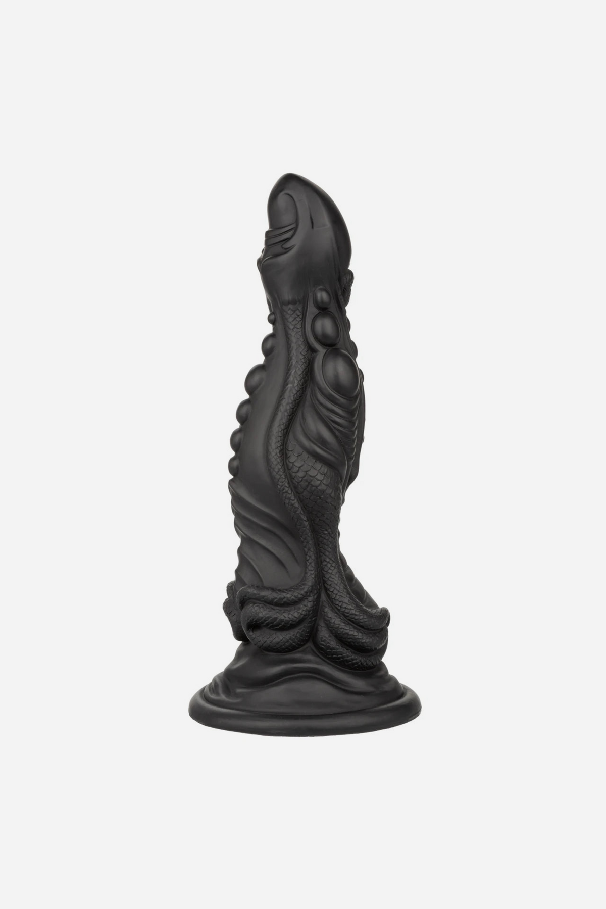 Side view of the black Colossus Monster Fantasy Dildo showing the textured scales, ridges and flared suction cup base, on grey