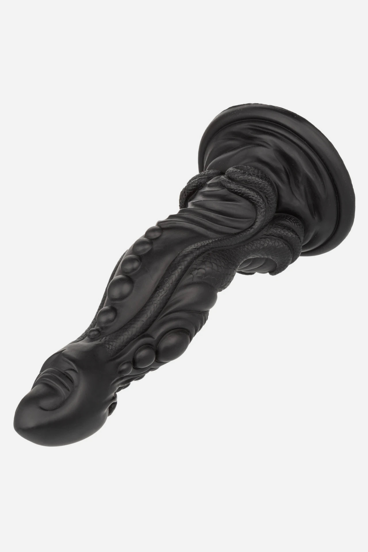 Black Colossus Monster Fantasy Dildo lying at an angle, showing the bulbous head, knotted ridges and wide suction cup base, on grey