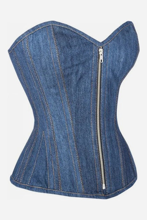 Three-quarter side view of the Cowbae Carter denim overbust corset showing its curved sweetheart bust, nipped waist and front zip closure