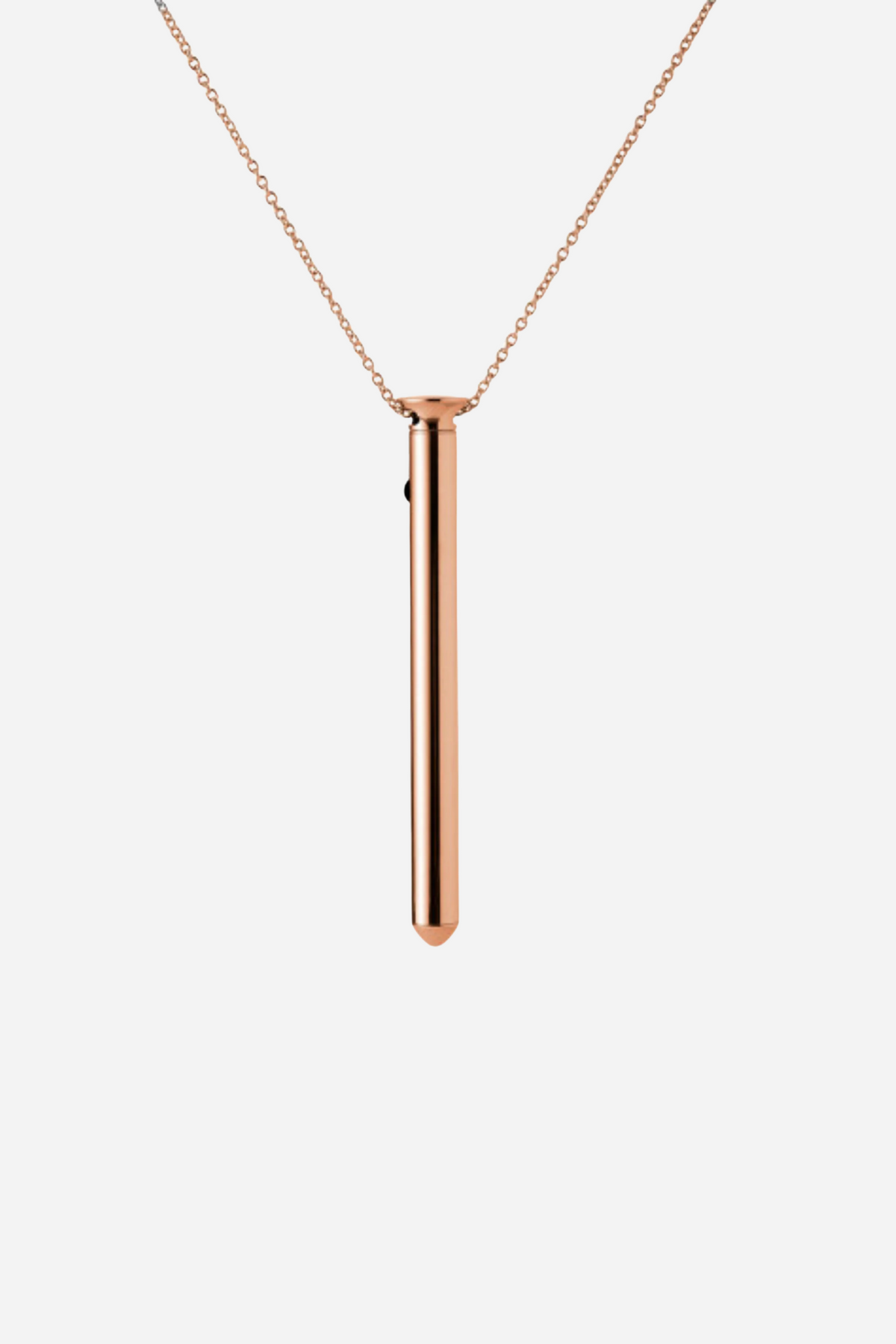 Crave Vesper 2 in rose gold, a slim tapered pendant vibrator hanging from a fine matching chain with its single button near the top.