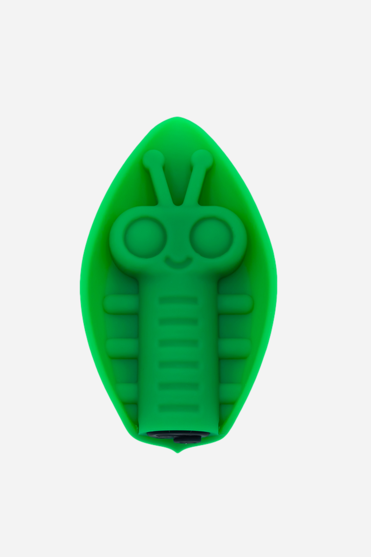 Emerald green Cute Little Fuckers Zeep grinding vibe on grey, a leaf-shaped silicone pad with a smiling bug face and ridged body raised on top.