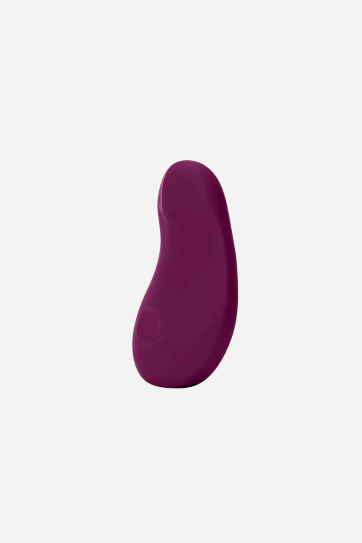 Side profile of the plum Dame Pom Flexible Palm Vibe showing its gentle curve and bendable silicone that flexes to fit the contours of the body