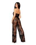 size small brunette model shows off the back of the lace jumpsuit with it's strapless design and wide leg pants.