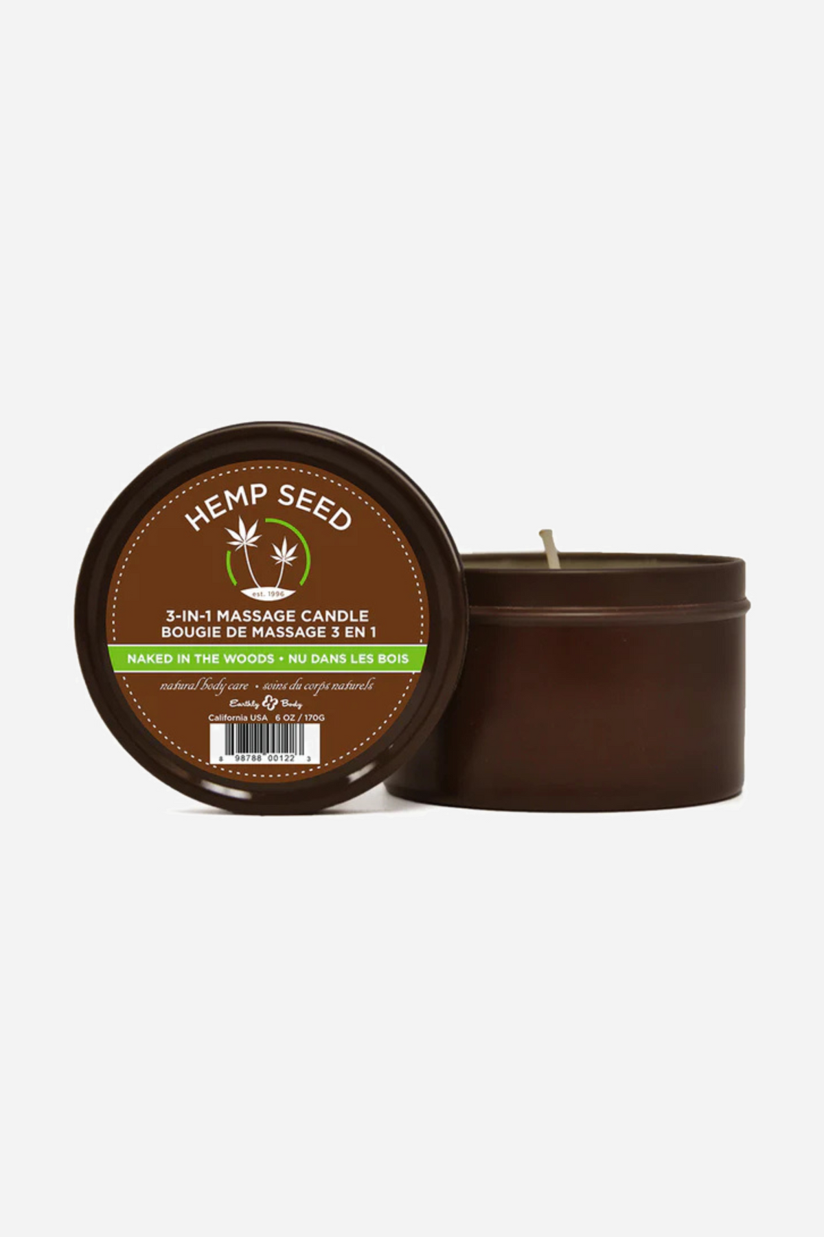 Two Hemp Seed massage candle tins, one propped up to show the Naked in the Woods label and one open beside it showing the wax