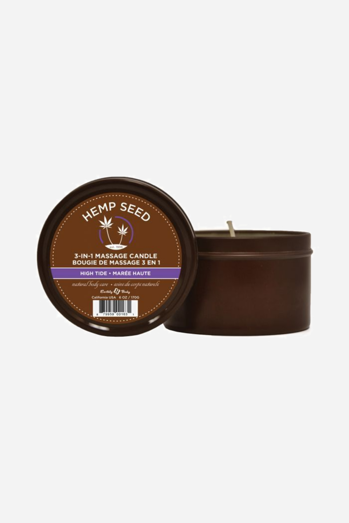 Two Hemp Seed massage candle tins, one propped up to show the High Tide label and one open beside it with the wick standing up