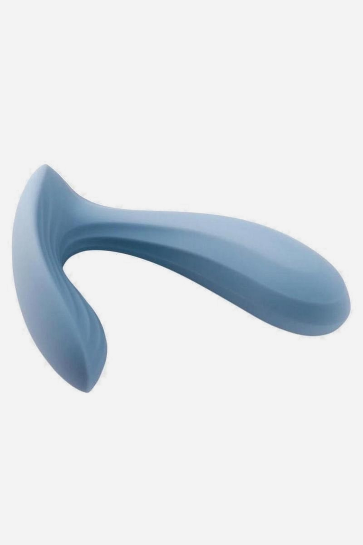 Dusty blue Erica wearable plug vibe lying on its side on grey, the curved external arm sweeping away from the tapered internal plug.