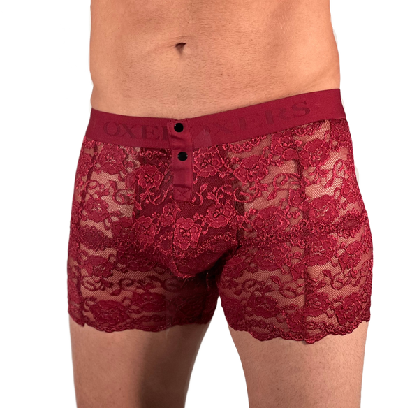 white male model with bulge is wearing black cherry red lace boxers with two front snaps and a thick matching red waistband