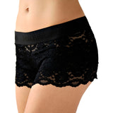 white female model in size small faces camera to show off the semi see through women's lace boxers in black