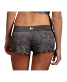 white female model in size small faces away from camera to show off the see through women's lace boxers in gray