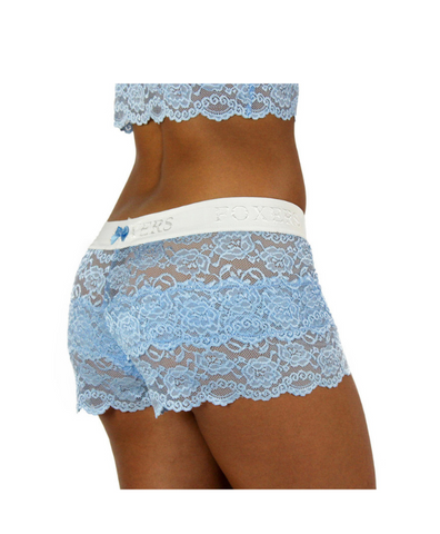white female model in size small faces away from camera to show off the see through women's lace boxers in light blue