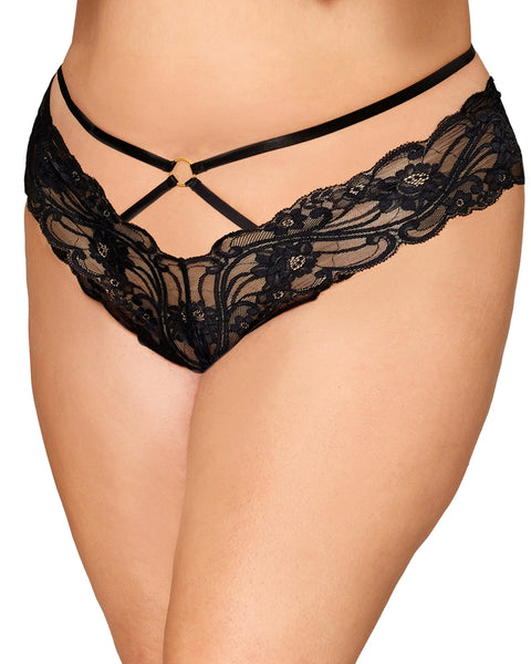 front view of a close up of a small white models wearing the glam perfection crotchless lace thong with strappy waist details