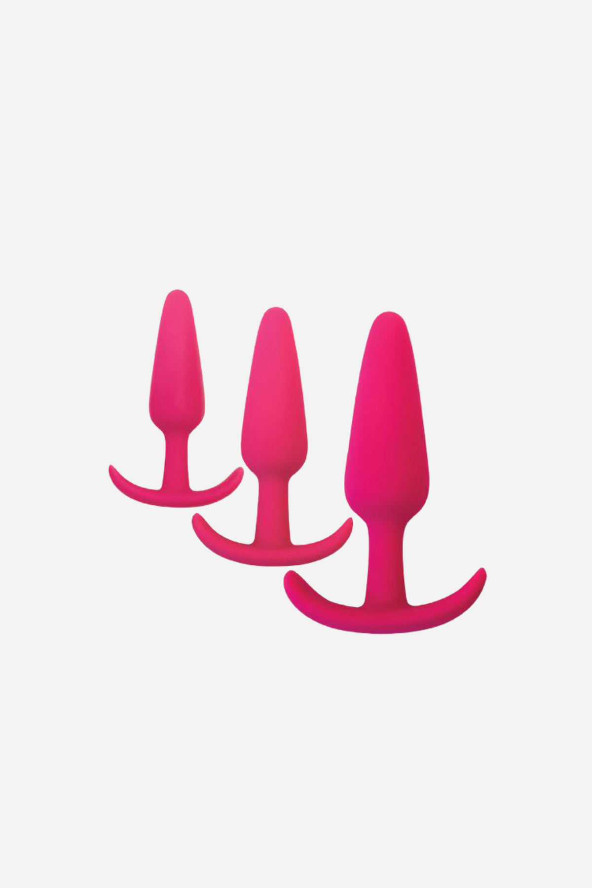 Gossip silicone anal plug trio in pink, three graduated tapered plugs each with a curved T bar base, lined up from small to large.