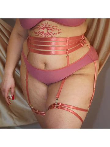 plus size white model is wearing theBralette in Copper Rose with the matching panty and Hearts of Venus Strappy Waist Cinching Garter in Copper Rose