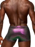 muscular black male model shows off the tight fitting back of the iridescent men's lingerie mini shorts