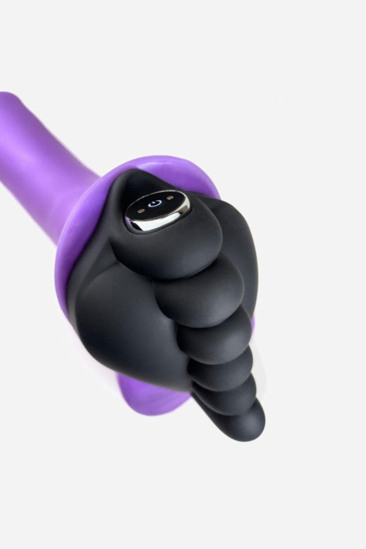 The black grinding pad fitted over a purple shaft, showing the pocket where the bullet sits and the control button on the front
