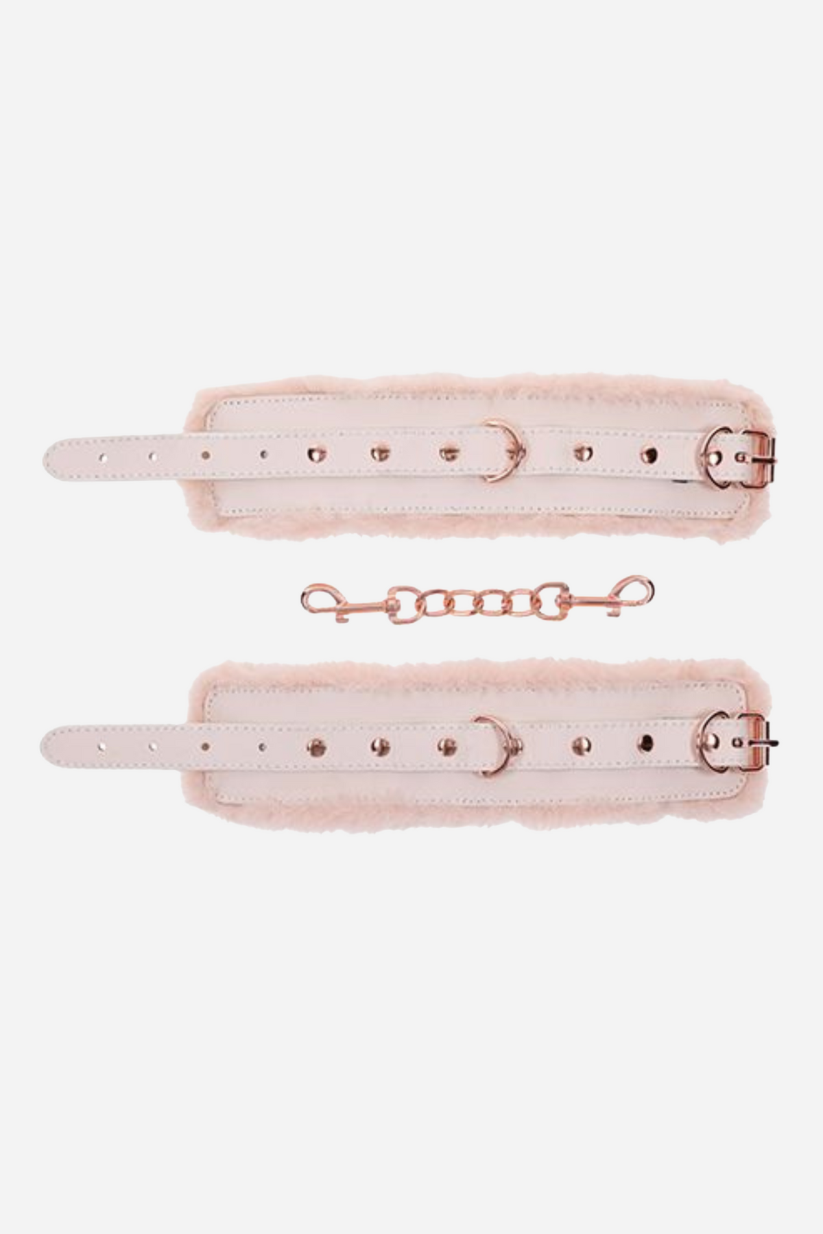 Two peachy cream pink cuffs laid open and flat, each lined with pale faux fur, with rose gold studs, buckles and a short connecting chain below.