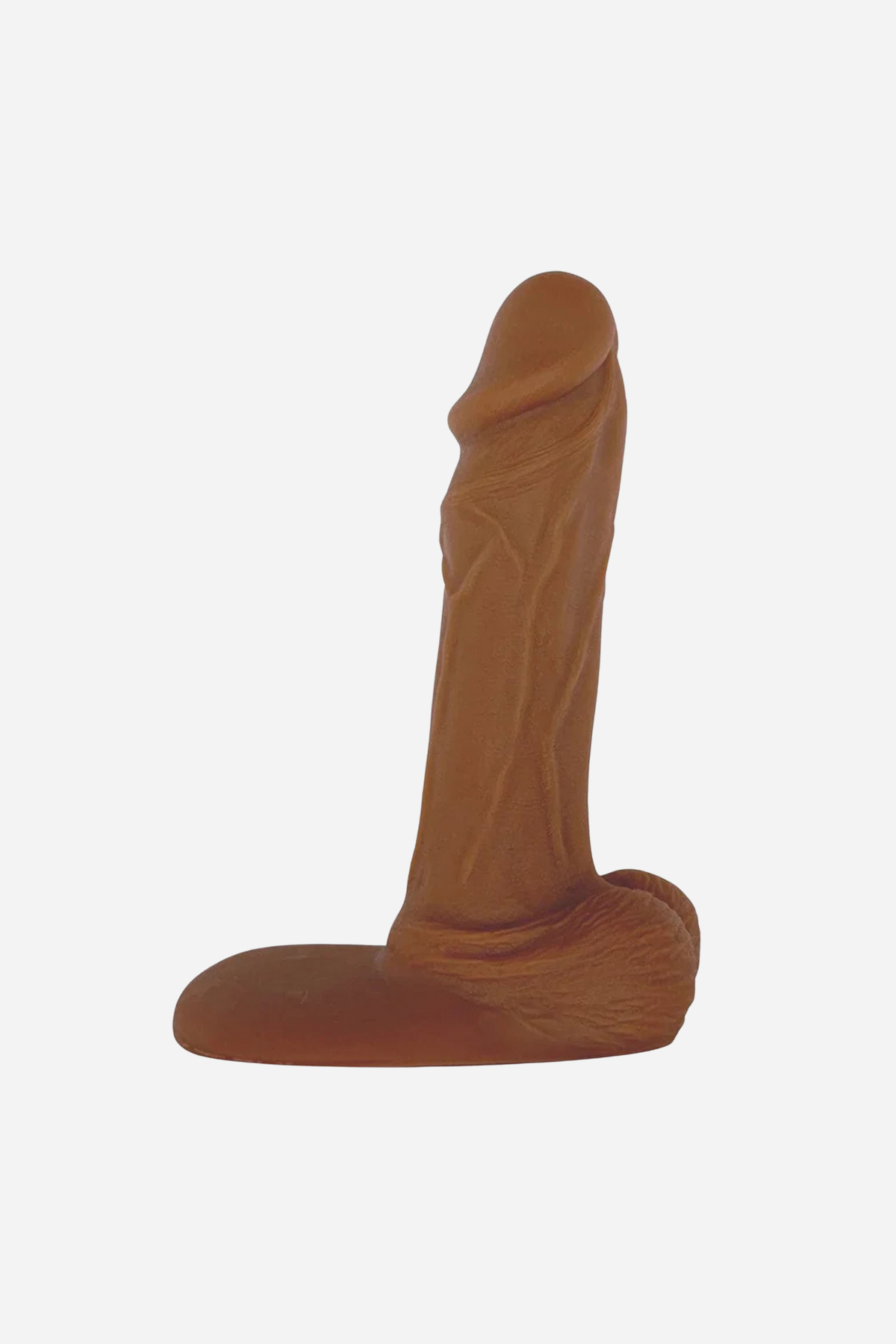 Caramel Jaxson realistic 7 inch single density silicone dildo with a detailed veined shaft, testicles and flat suction base, on grey