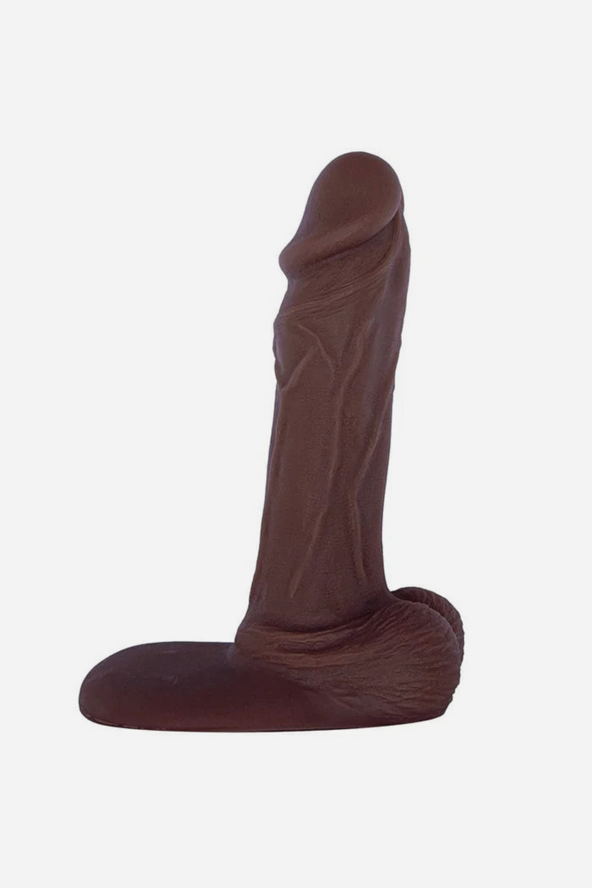 Chocolate Jaxson realistic 7 inch single density silicone dildo with a detailed veined shaft, testicles and flat suction base, on grey