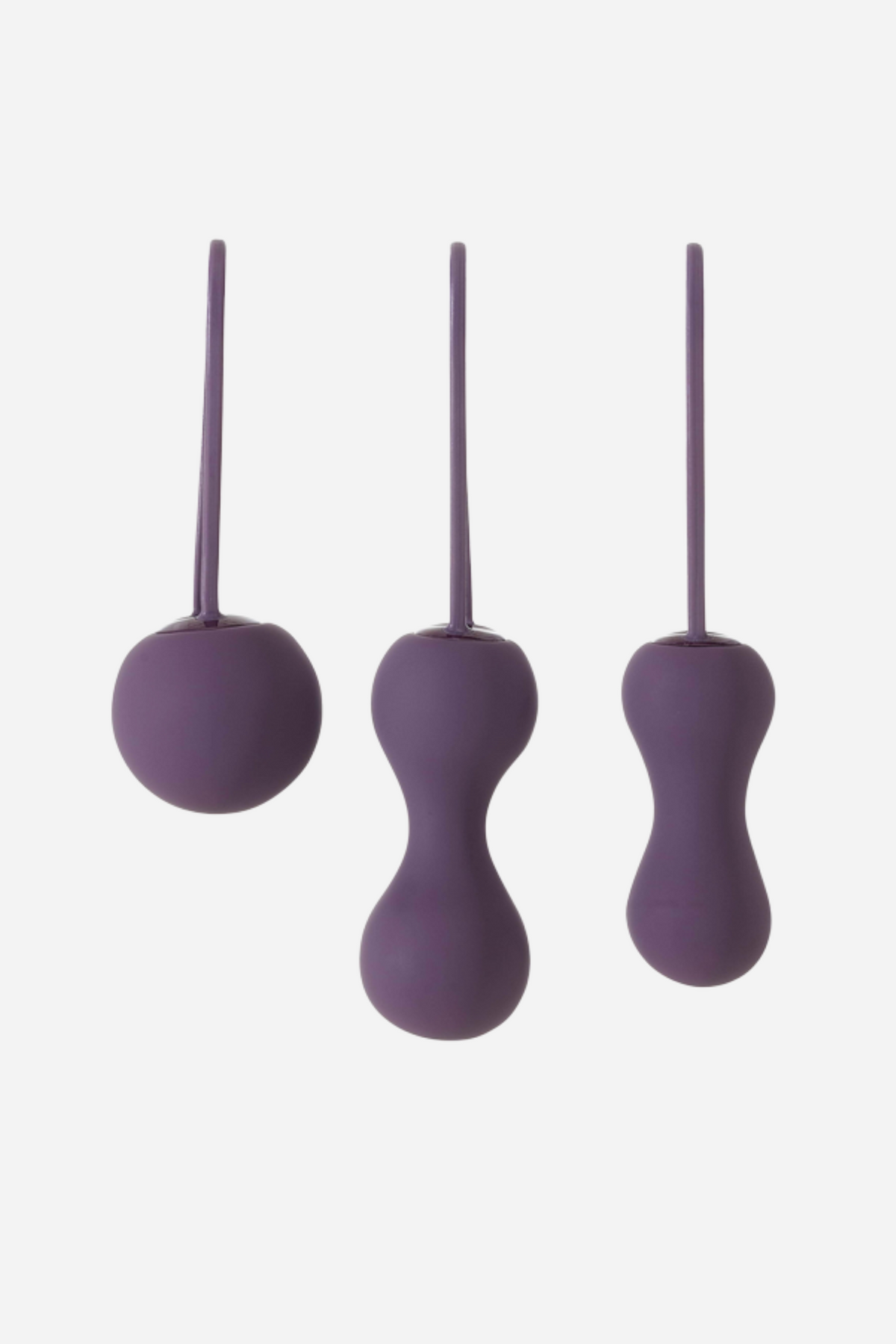Purple Je Joue Ami kegel balls set of three graduated silicone weights, single and double balls with retrieval loops, on grey