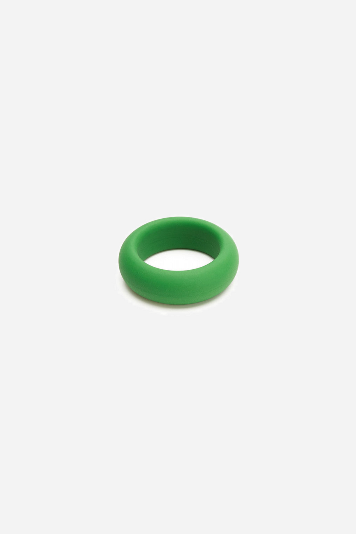 Close-up of the green silicone C-ring lying at an angle, showing the thickness of the band