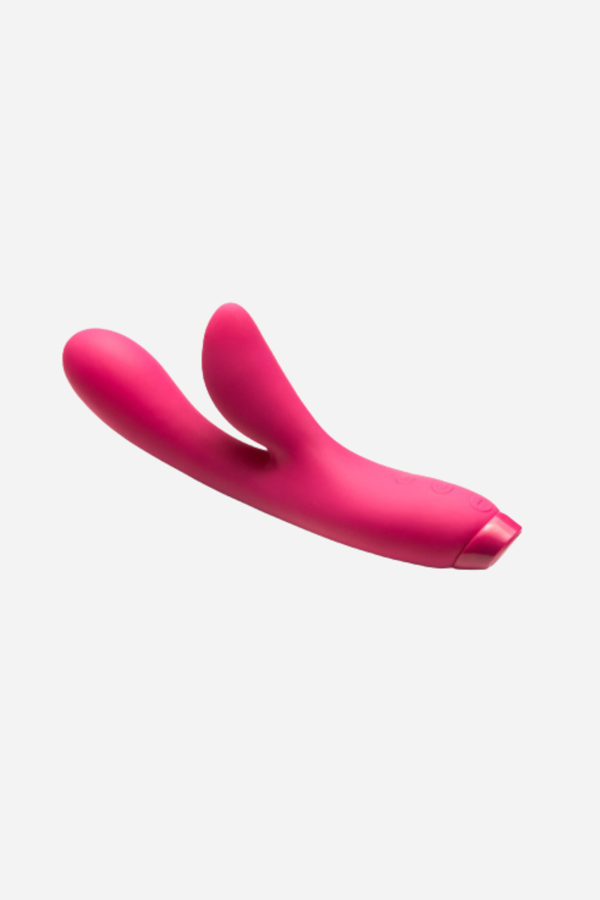Je Joue Hera rabbit vibrator in Fuchsia lying on its side, showing the curved shaft, clitoral arm and control base on light grey