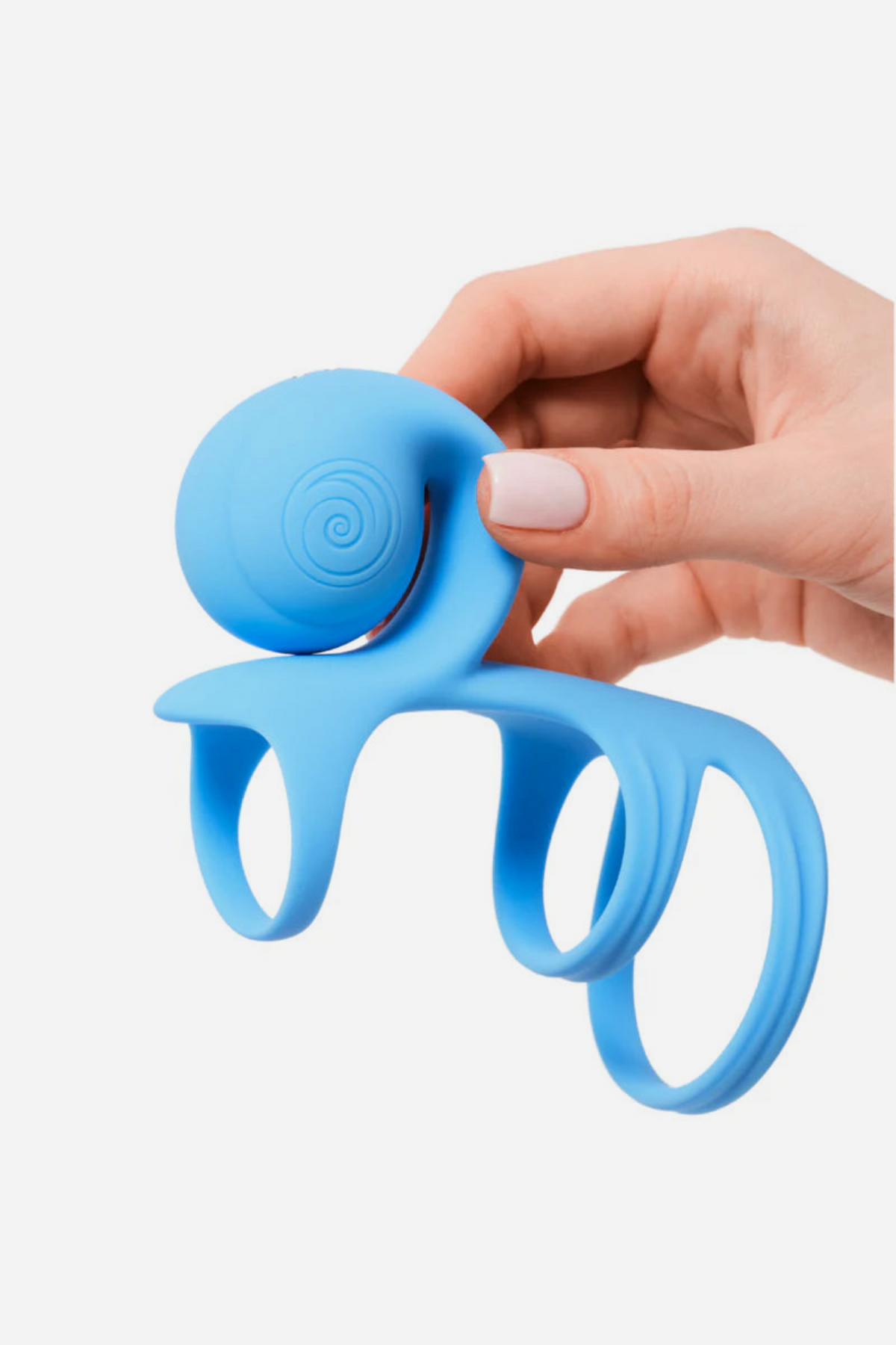 Hand holding the blue haze Jovi Tri Arc Cock Ring by its motor, showing the contoured arc and stretchy triple-ring silicone sheath