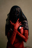 model stands with black lace over her face and her arms are covered with the Kilo Brava Ruched Mesh Opera Gloves in Ruby Wine