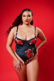 plus size light skinned black model wears the Kilo Brava Velvet Applique Underwire Teddy on  red backgrounds