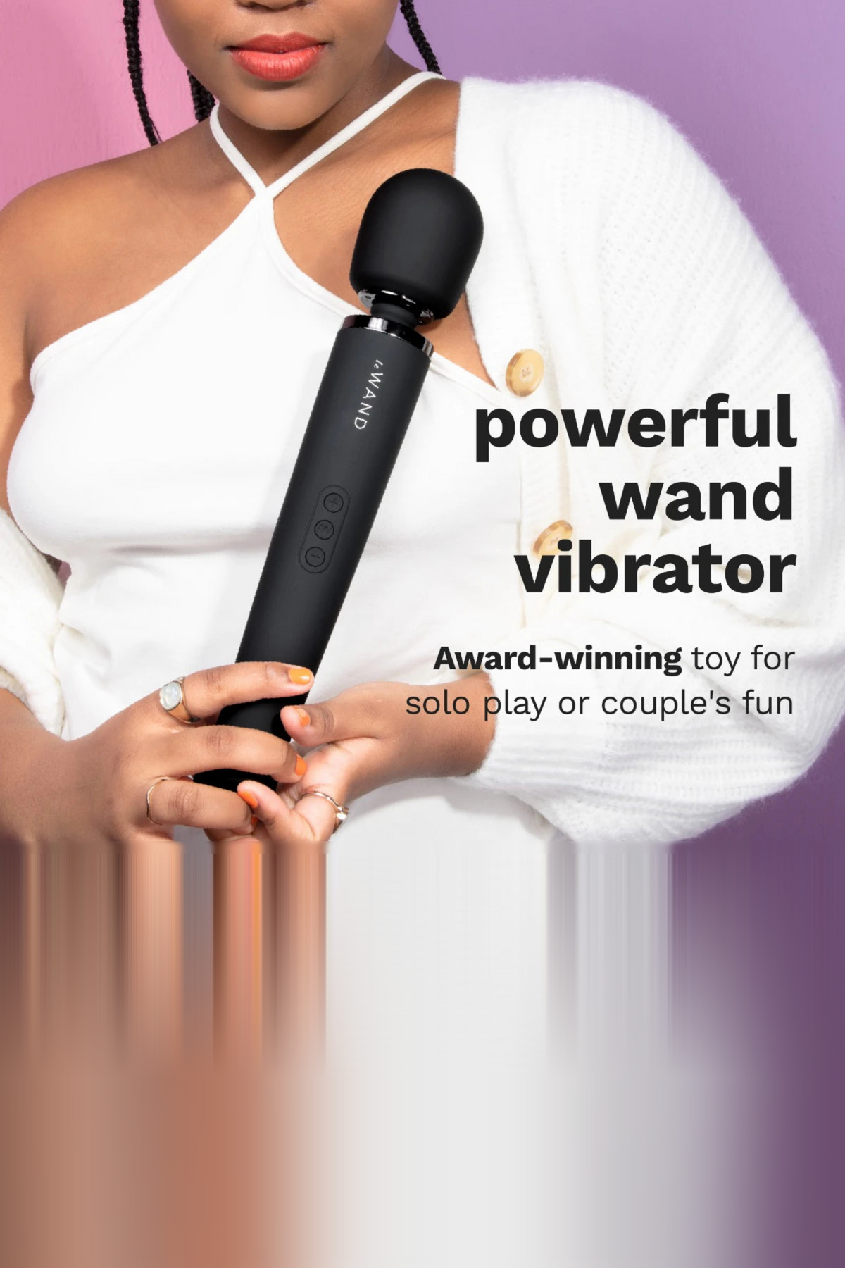 Woman in a white top holding the black Le Wand Original Rechargeable Wand, with text calling it a powerful, award-winning wand vibrator