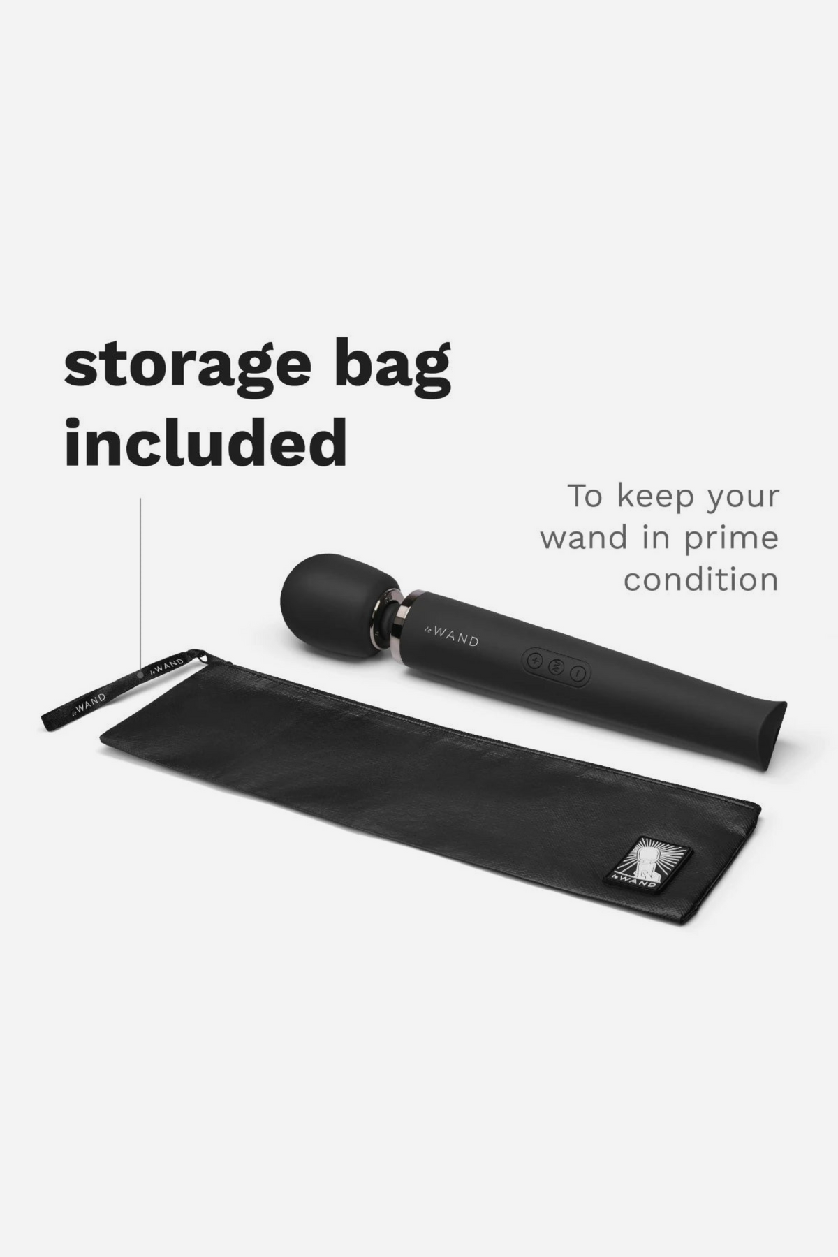 Black Le Wand Original Rechargeable Wand lying on its included black storage bag, which keeps the wand in prime condition between uses