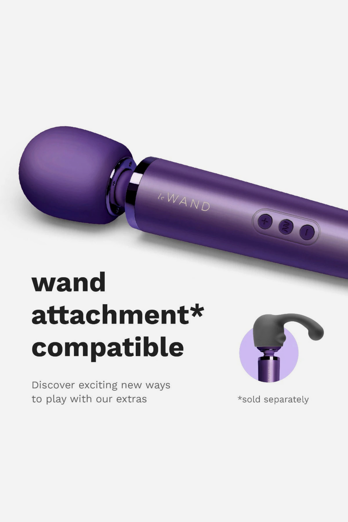 Close-up of the purple Le Wand Original Rechargeable Wand head and buttons, with text noting it is compatible with Le Wand attachments
